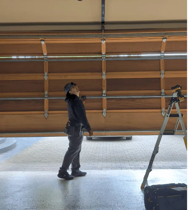 Northbridge Garage Door technician repairing residential garage door opener in Seattle, WA